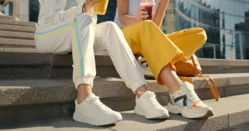 friends, legs and shoes on city steps for bonding, travel and urban break with drinks, smoothie and beverage, couple, people and town stairs for fashion, cool and trendy street style clothing - fashion stock pictures, royalty
