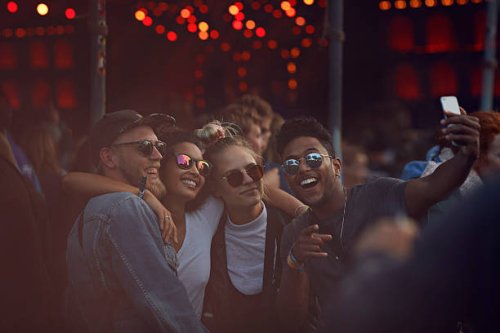 friends making selfie at concert - concert stock pictures, royalty-free photos & images