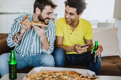 friends playing video games - junk food stock pictures, royalty-free photos & images