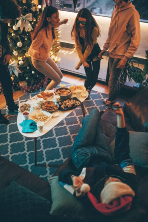 friends singing and having fun at christmas party - junk food stock pictures, royalty-free photos & images