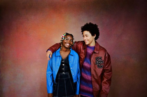 friends standing against brown background - fashion stock pictures, royalty-free photos & images