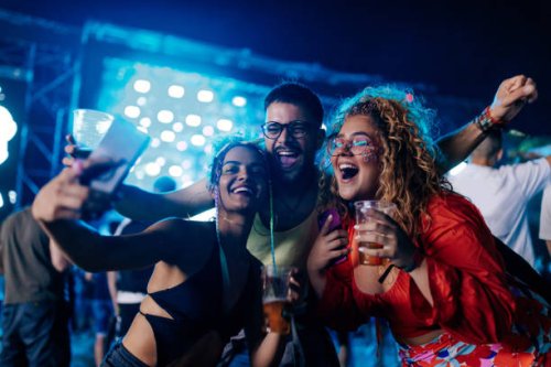 friends taking selfie at music festival. - concert stock pictures, royalty-free photos & images