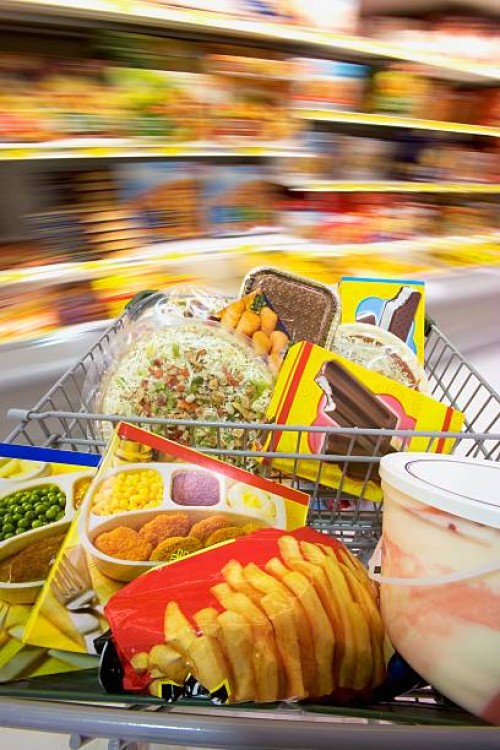 frozen food in shopping cart - junk food stock pictures, royalty-free photos & images