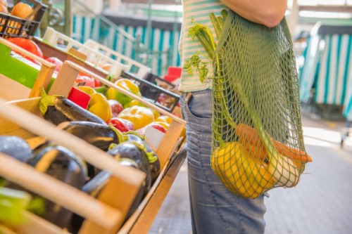 fruits and vegetables in a cotton mesh reusable bag, zero waste shopping concept - food stock pictures, royalty-free photos & images
