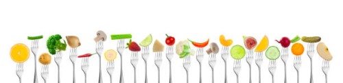 fruits and vegetables on fork - food stockfoto's en -beelden