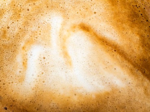 full frame of a cup of freshly made coffee with milk, backgrounds. - coffee stockfoto's en -beelden