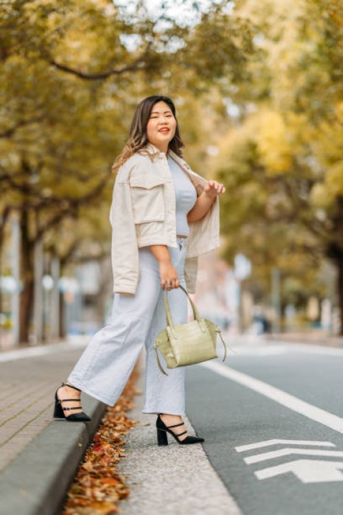 full size portrait of young woman in street in autumn - fashion stock pictures, royalty-free photos & images