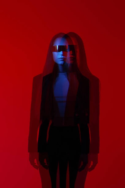 futuristic fashion woman with futuristic sunglasses in red glowing background - fashion stock pictures, royalty-free photos & images
