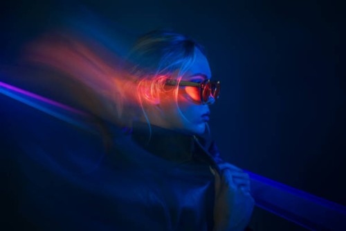 futuristic woman in neon lights with sunglasses - fashion stock pictures, royalty-free photos & images