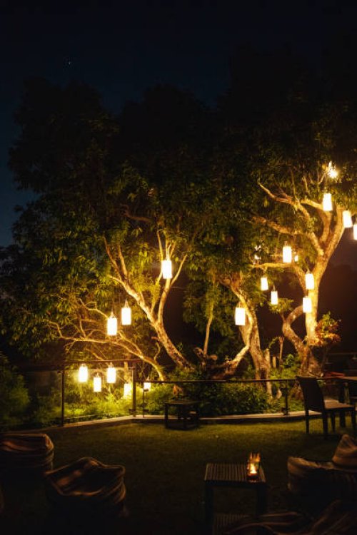 garden bar decorated with illuminated lantern at night - garden decoration stock pictures, royalty-free photos & images