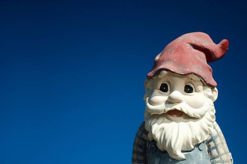 garden gnome with red hat on a blue background - garden decoration stock pictures, royalty-free photos & images