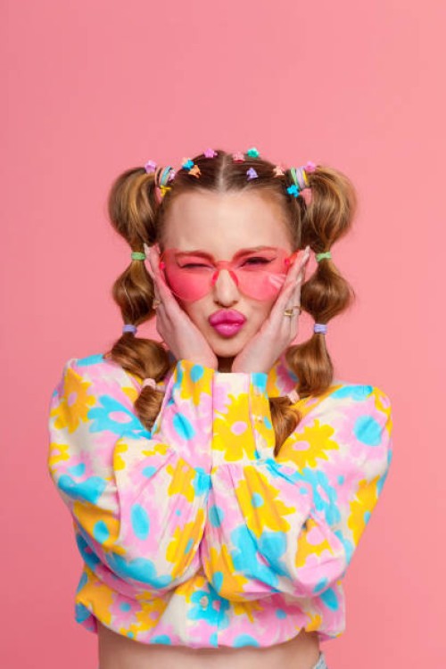 gen z young woman with stylish hairstyle against pink background - fashion stock pictures, royalty-free photos & images