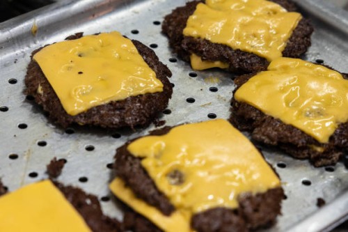 General picture shows grilled cheeseburgers at Meat Crew fast food restaurant on May 28, 2023 in Milan, Italy. On occasion of the World Burger Day,...