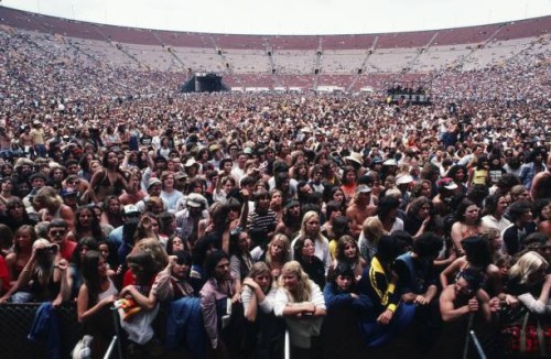 General view of fans standing at the front of the stage at the Los Angeles Memorial Coliseum for a 1979 Los Angeles, California, concert by Eddie...