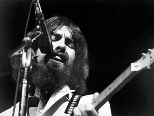 George Harrison performs onstage at the Concert for Bangladesh which was held at Madison Square Garden on August 1, 1971 in New York City, New York.