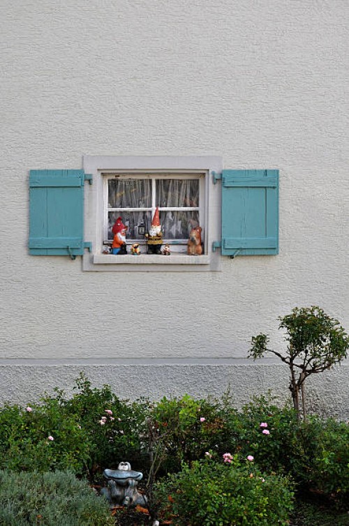 germany, baden wuerttemberg, window with shutter and garden gnomes - garden decoration stock pictures, royalty-free photos & images