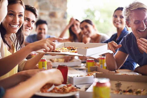 getting together for pizza - junk food stock pictures, royalty-free photos & images