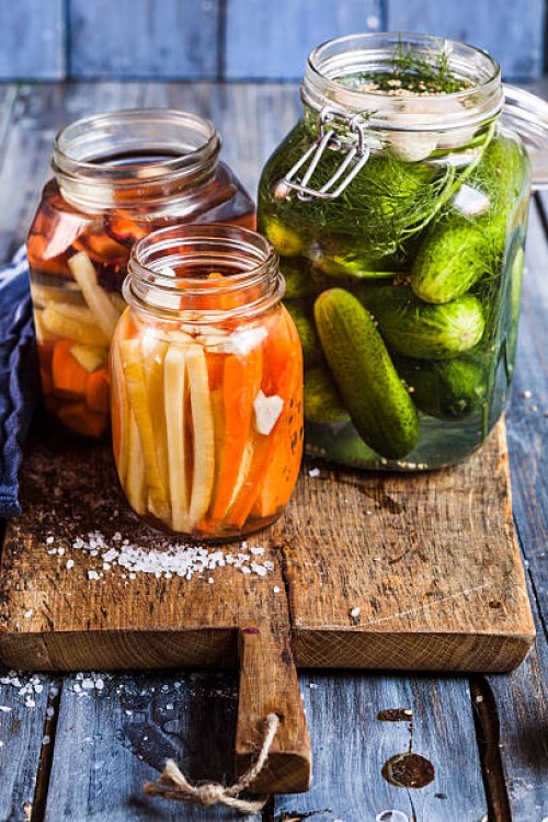 gherkins fermenting, gherkins and carrots in preserving jars - food stock pictures, royalty-free photos & images