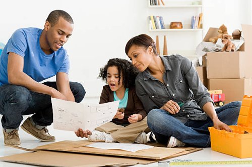 girl and parents building furniture - home decoration stock pictures, royalty-free photos & images