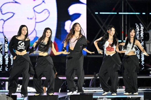 Girl group NewJeans perform on stage during the K-pop Super Live" Concert after the 2023 World Scout Jamboree closing ceremony at Sangam World Cup...