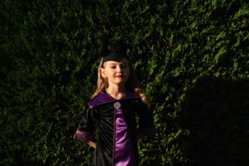 girl in a festive costume outside. halloween. candy or death. pumpkin. holiday. masquerade. - garden decoration stock pictures, royalty-free photos & images