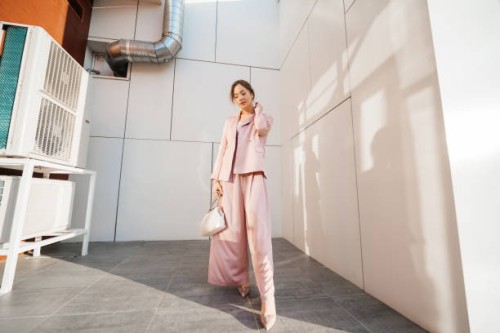 girl near a light wall evening sun - fashion stock pictures, royalty-free photos & images