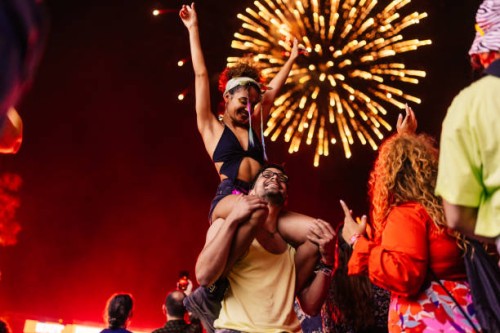 girl on boyfriends shoulders at festival - concert stock pictures, royalty-free photos & images