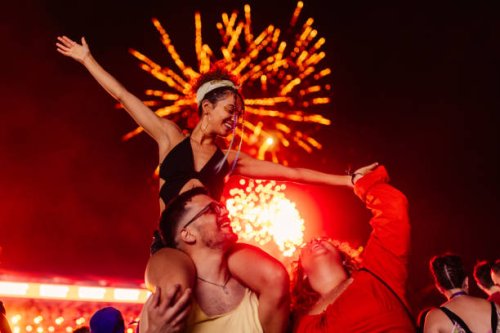 girl on boyfriends shoulders dancing at festival - concert stock pictures, royalty-free photos & images