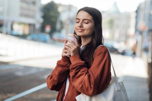 girl smells coffee - junk food stock pictures, royalty-free photos & images