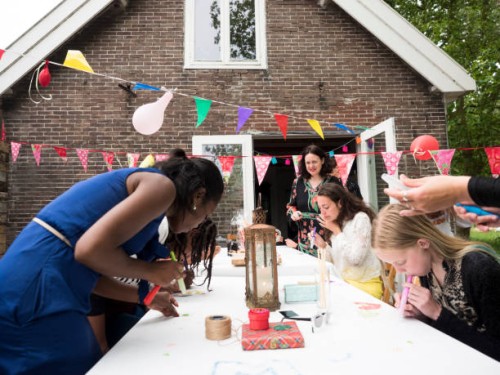 girls and women decorating for birthday party - garden decoration stock pictures, royalty-free photos & images
