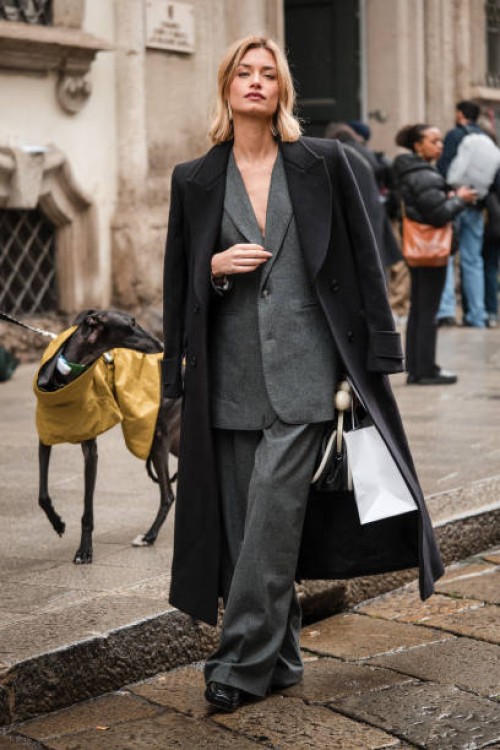 Giulia Arena wears grey suit, black maxi coat, outside Blumarine, during the Milan Fashion Week - Womenswear Fall/Winter 2024-2025 on February 23,...