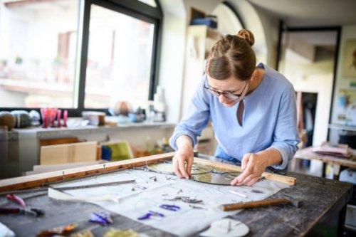 glass artist craftswoman working in her studio - nails art stock pictures, royalty-free photos & images
