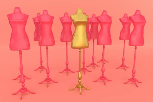 golden mannequin stand out in a group of pink mannequins - fashion stock pictures, royalty-free photos & images