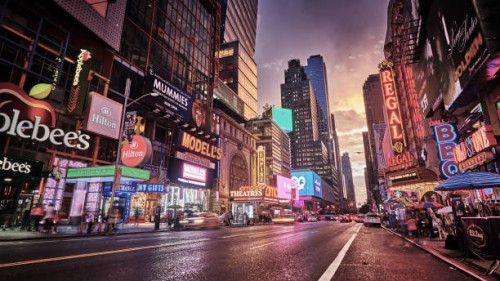 grand shine of 42nd street. new york. classical view of times square. illuminated advertisement billboards. dramatic sunset. - fashion stock pictures, royalty-free photos & images