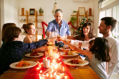 grandfather proposing a toast at christmas dinner in buenos aires - food stock pictures, royalty-free photos & images