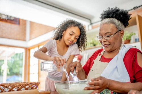 grandma and granddaughters making christmas cookies - food stock pictures, royalty-free photos & images