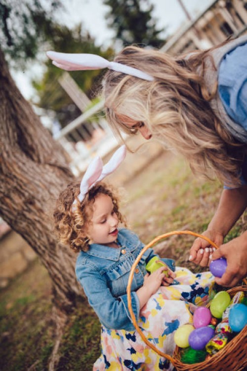 grandmother and granddaughter with easter eggs basket in garden - garden decoration stock pictures, royalty-free photos & images