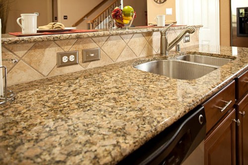 granite kitchen counter with dishwasher underneath. sink. bar. - home decoration stockfoto's en -beelden