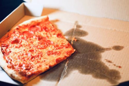 greasy pizza in a delivery box - junk food stock pictures, royalty-free photos & images