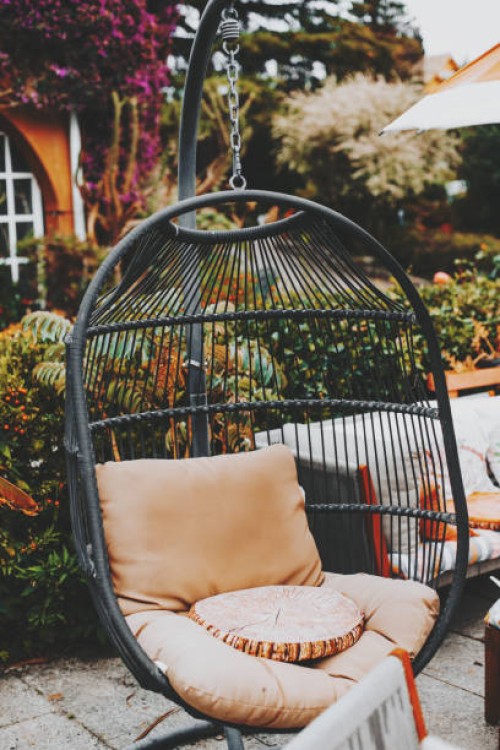 green metal garden furniture in a small garden. - garden decoration stock pictures, royalty-free photos & images