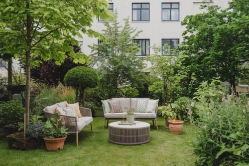 green summer garden with sofa and coffee table - garden decoration stock pictures, royalty-free photos & images