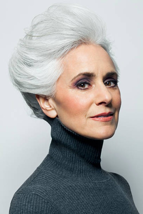 grey haired woman with updo, portrait. - fashion stock pictures, royalty-free photos & images