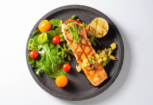 grilled salmon steak with green salad - food stock pictures, royalty-free photos & images