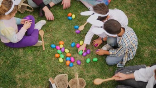 group of children and parents gathering at family garden for easter event - garden decoration stock pictures, royalty-free photos & images