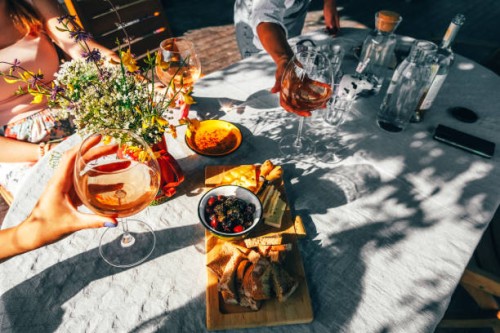 group of female friends drinking wine outside. - food stock pictures, royalty-free photos & images