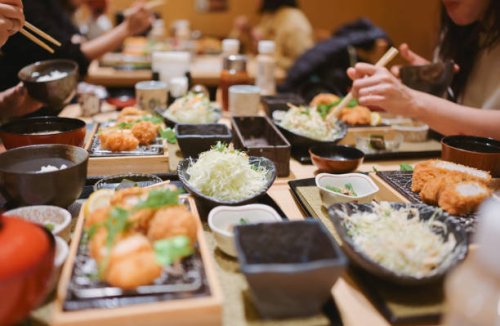 group of friend dinning traditional japanese food tonkatsu set with variety of japanese food - food stock pictures, royalty-free photos & images