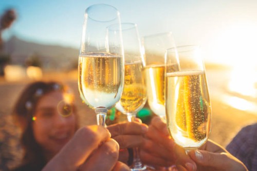 group of friends making a champagne toast on the beach. - concert stock pictures, royalty-free photos & images