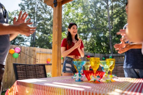 group of friends singing happy birthday at a party - garden decoration stock pictures, royalty-free photos & images