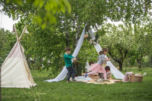 group of kids playing in front yard on easter egg hunt - garden decoration stock pictures, royalty-free photos & images