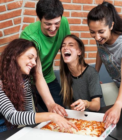 group of people eating pizza - junk food stock pictures, royalty-free photos & images